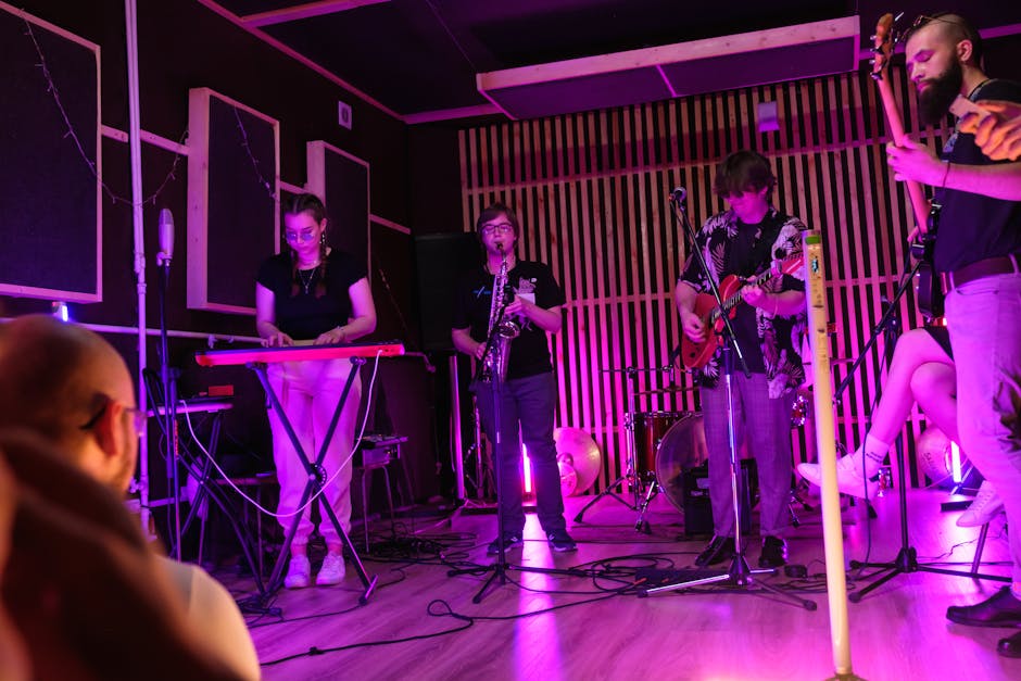 A live music gathering with the audience gathered close to the stage.